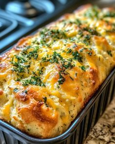 a casserole dish with cheese and herbs