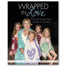 a book cover for wrapped in love with two women and three girls wearing scarves