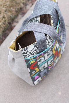 an open purse sitting on top of a sidewalk