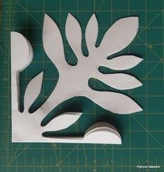 the paper cut out is ready to be made into a flower or leaf decoration with scissors