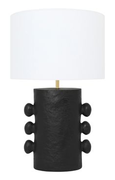 a black table lamp with a white shade