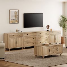 a living room filled with furniture and a flat screen tv on top of a wooden dresser