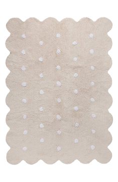 a white rug with polka dots on it