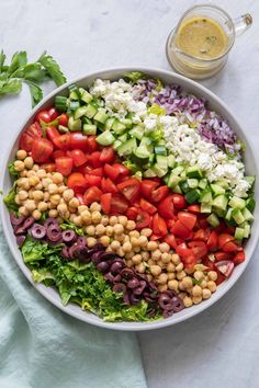 a large salad in a bowl with dressing