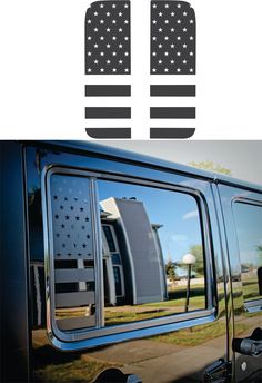 an american flag is reflected in the side window of a black truck with stars on it