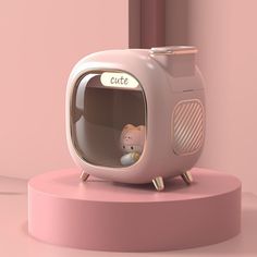 a pink cat house with a small kitten in it's window and the word cutte written on its side