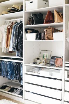 a white closet filled with lots of clothes and handbags on top of it's shelves