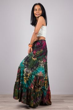 "Tie Dye Skirt, Festival Skirt, Hand Dyed Maxi Skirt , Hippie Skirt, lounge wear skirt, tiered skirt PRODUCT SIZE : One Size Fits Most * Waist : up to 40\" * Hips : up to 44\" * Length : 40\" MATERIAL * Cotton Tie Dye (T-shirt like) NOTE : * Model chest : 32\", waist : 24\" hips : 35\" * Combined Height is 5\"6 > I'm 5\"2 (158cm) and I'm wearing 4\" heels in the pictures PRODUCT CARE : * Wash separate in cold water. Lay flat to dry This skirt stands out from the crowd with its magnificent col Relaxed Cotton Skirt In Hippie Style, Relaxed Fit Cotton Hippie Skirt, Bohemian Tiered Flowy Skirt, Bohemian Tiered Bottoms With Elastic Waistband, Bohemian Tiered Cotton Maxi Skirt, Cotton Hippie Flowy Skirt Bottoms, Bohemian Cotton Skirted Bottoms, Flowy Cotton Hippie Skirt, Hippie Style Flowy Cotton Skirt