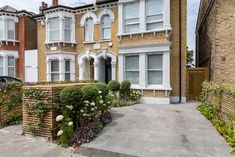 a row of brick houses with white windows