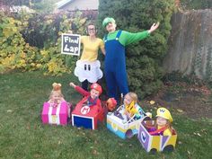 two adults and three children dressed up in costumes