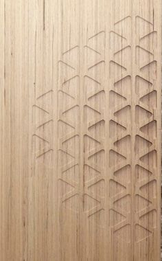 an image of a wooden wall that has been carved into some sort of design on it