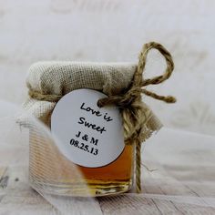 a jar filled with honey sitting on top of a table