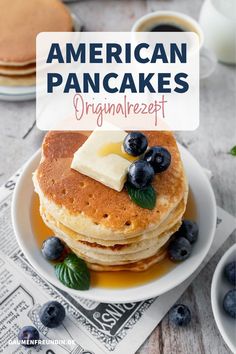 pancakes with butter and blueberries on a plate