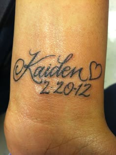 a foot with a tattoo on it that says kalen's 2012 and 2012