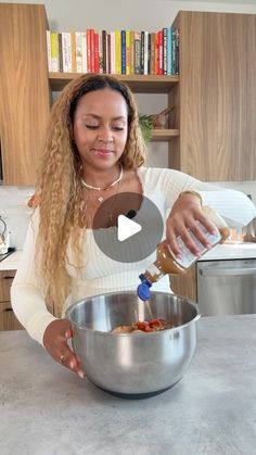 a woman is pouring something into a bowl