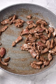 the food is being cooked in the pan on the stove top and ready to be eaten