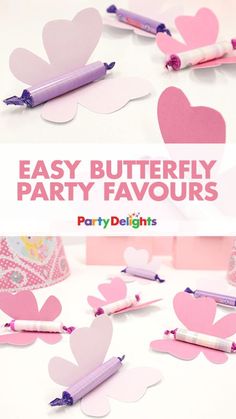 easy butterfly party favors with crayon pens and paper hearts on the top, in pink