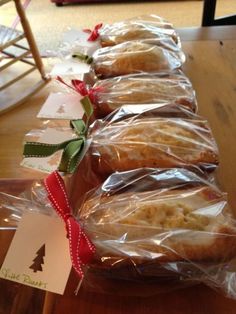 some cookies wrapped in plastic sitting on top of a table