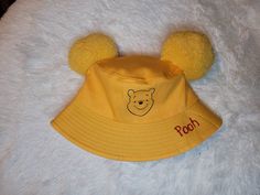 As seen on picture. Each hat is made by hand and hand crafted. One size 22.8 in in crown one size adult hats can fit ages 6 and up. Please make sure you check the size before ordering. And also please check adress when ordering Cute Costume Cap Hat, One Size Fits Most, Fun Adjustable Hats With Ears, Cute Mini Bucket Hat, Cute Handmade Yellow Hat, Cute Yellow Adjustable Hat, Cute Adjustable Yellow Hat, Pooh Bear Inspired Outfit, Winnie The Pooh Fashion, Winnie The Pooh Mouse Ears