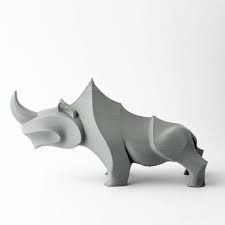 the rhinoceros are made out of white and grey plastic, with horns on their heads