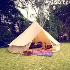 a teepee tent is set up in the grass