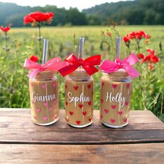 three jars with hearts and name on them