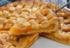 a close up of a pie on a plate with a fork