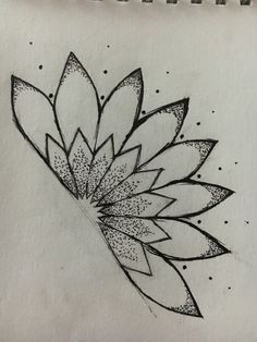 a drawing of a flower on paper