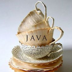 stack of stacked books with the word java written on them and folded in paper