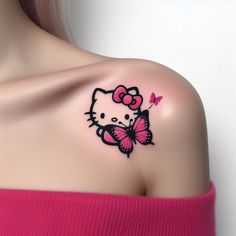 a woman's shoulder with a pink butterfly and hello kitty tattoo on her left shoulder