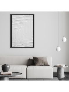 a living room with a white couch and table