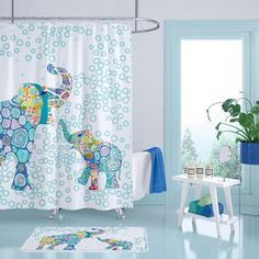 an elephant shower curtain in a bathroom with blue walls and white flooring, along with a potted plant