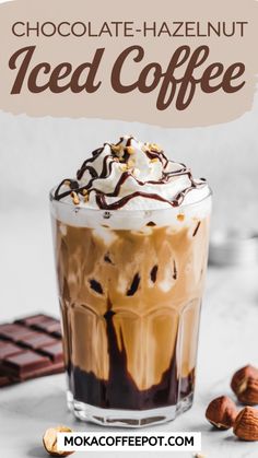 an iced coffee with whipped cream and chocolate on top