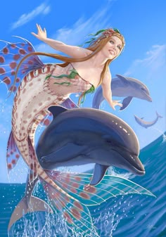 a beautiful woman riding on the back of a dolphin