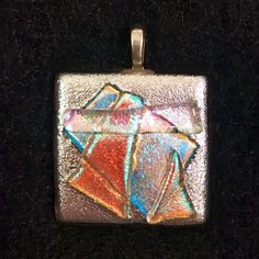 Very Sparkly Fused Glass Dichroic Pendant. Dichroic Shifts In Color Depending On The Angle. Multiple Layers Of Dichroic Glass Are Lightly Stacked And Fused To Keep Their Dimensional Crystal Like Shape In This Beautiful Pendant. The Colors Are So Mesmerizing, Like Prisms In A Chandelier! Materials: Dichroic Glass, Sterling Silver Plated Bail. Colors Are Pink, Teal, Blue, Magenta With Hues Of Red Dichroic Glass. Purchased Item At An Art Show. Item Is Handmade. Does Not Come With Chain. Never Worn. Dichroic Pendant, Fused Glass Pendant, Fused Glass Jewelry, Prisms, Dichroic Glass, Glass Jewelry, Art Show, Glass Pendants, Fused Glass