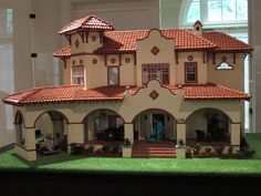 a model of a house on display in a room