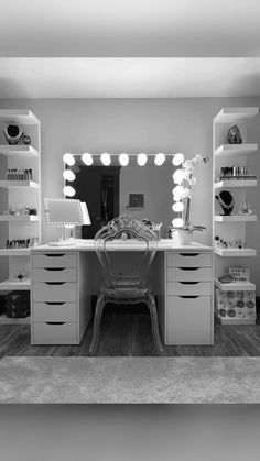 a vanity with lighted lights and drawers in a home office area, black and white photograph