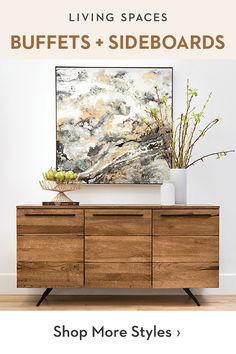 a wooden dresser sitting in front of a painting