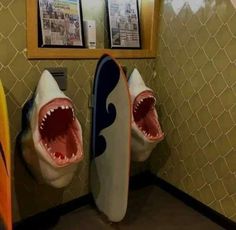 there are two shark heads on the urinals