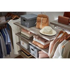 an organized closet with clothes, hats and handbags