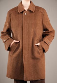 A beautiful male 90's coat by Valmeline. The warm brown wool fabric is similar to that of Loden coats, with slightly long and coarse fibers. It feels thick and sturdy, keeping you warm in those cold winter days. The inside checkered wool lining feels soft and not itchy at all. The coat is in mint condition, there are no damages whatsoever.  While it is a male coat, I would also recommend it to women that like a bit of an androgynous look. I am 175cm (5.9ft) tall and usually wear a female size M. Brown Wool Pea Coat With Button Closure, Brown Wool Business Outerwear, Classic Brown Wool Coat With Button Closure, Classic Brown Wool Pea Coat, Brown Single-breasted Wool Coat, Brown Wool Coat For Business, Business Brown Wool Coat, Brown Wool Coat With Button Closure, Brown Single-breasted Wool Coat For Winter