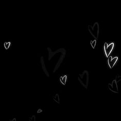 hearts drawn in the dark on a black background