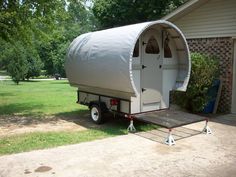 a trailer with a tent attached to it