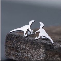 Brand New Small And Simple Silver Stainless Steel Dinosaur Stud Earrings. Stainless Steel Does Not Tarnish Or Rust And Can Last Up To Two Decades. Invest In Jewelry That Lasts. Dino Earrings, Top Grades, Tiny Dinosaur, Chunky Gold Hoop Earrings, Dinosaur Earrings, Ear Crawler Earrings, Cute Stud Earrings, Round Dangle Earrings, Crawlers Earrings