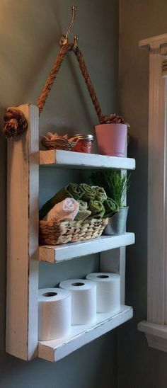 a shelf with some toilet paper and other items on it