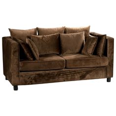 a brown couch with many pillows on it's back and arm rests against a white background