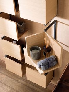 a shelf with some items on it in a room that has wood floors and walls