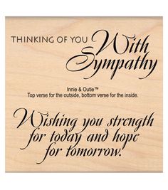 a wooden plaque that says thinking of you with sympathy