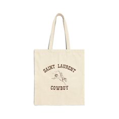 Calling all Saint Laurent Cowboy stans. Role Model / Kansas Anymore tote bag merch. Pull up to your local coffee shop to get some of that me espresso... This 100% cotton bag comes in one size - 15" x 16"- perfect for everyday wear. While the canvas material will show off your designs in great colors, it's durable and will last for years. The bag features 20" handles (made from the same canvas), making it easy to carry even with a week's worth of shopping. .: 100% cotton canvas .: Heavy fabric (1 Kansas Anymore, Cloth Tote Bag, Local Coffee, Canvas Making, Local Coffee Shop, Tote Bag Patters, Role Model, Sand Color, Canvas Tote Bag