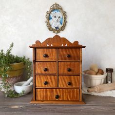 Add old-world charm and functional storage to your home with this late 19th-century antique wooden apothecary spice cabinet! Ideal for organizing spices, jewelry, or small essentials, it features sturdy wood construction with a gorgeous grain and rich patina. Recently cleaned and carefully rehydrated with food-grade natural wood oil, it's ready for use. Versatile design allows for wall mounting with a round hook or use as a tabletop piece.  See photos for detailed dimensions and scale. *Only the Organizing Spices, Victorian Cottagecore, Cottagecore Farmhouse, Spice Cabinet, Rustic Kitchen Decor, Spice Organization, Wood Oil, Cabinets Organization, Functional Storage